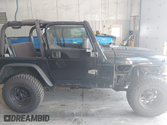 1999 Jeep Wrangler Sport with VIN 1J4FY19S4XP494405, listed as a IAAI auction lot 42542416 with 168,856 mi miles and . Bid and sale history available at DreamBid. Image 13.