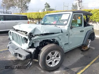 2023 Jeep Wrangler Willys z VIN 1C4HJXAG0PW600660, wystawiony jako IAAI lot #41713238 z przebiegiem 43 717 mil mil oraz . Historia ofert i sprzedaży dostępna na DreamBid. Obrazek 2.