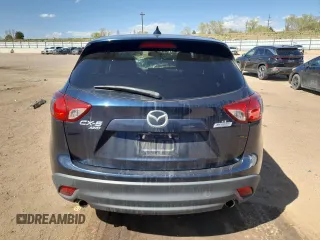 2016 Mazda CX-5 Touring z VIN JM3KE4CY8G0758947, wystawiony jako Copart lot #53140005 z przebiegiem 47 172 mil mil oraz Szkoda całkowita • Salvage title. Historia ofert i sprzedaży dostępna na DreamBid. Obrazek 6.