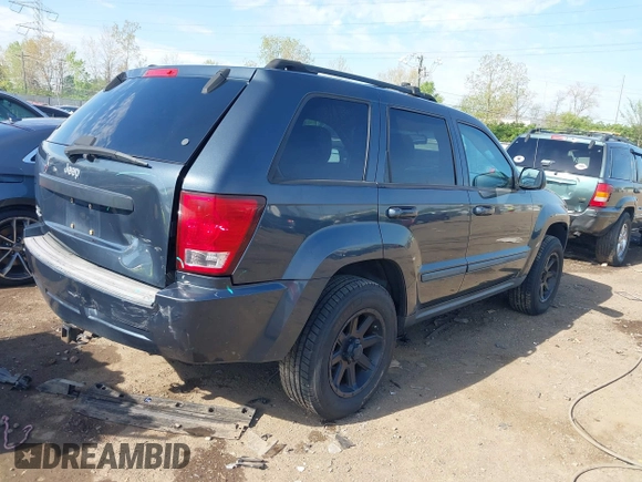 2007 Jeep Grand Cherokee Laredo with VIN 1J8GR48K77C582875, listed as a IAAI auction lot 42061653 with 259,767 mi miles. Bid and sale history available at carsss.com. Image 4.