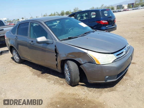 2009 Ford Focus SE with VIN 1FAHP35N69W244451, listed as a IAAI auction lot 42104982 with 199,524 mi miles. Bid and sale history available at carsss.com. Image 1.