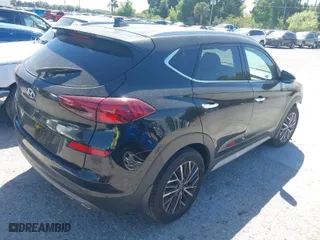 2021 Hyundai Tucson Limited with VIN KM8J33AL9MU305948, listed as a IAAI auction lot 41834956 with 100,098 mi miles. Bid and sale history available at carsss.com. Image 4.
