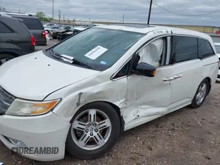 2013 Honda Odyssey Touring with VIN 5FNRL5H96DB074819, listed as a IAAI auction lot 41898358 with 123,428 mi miles and . Bid and sale history available at carsss.com. Image 6.