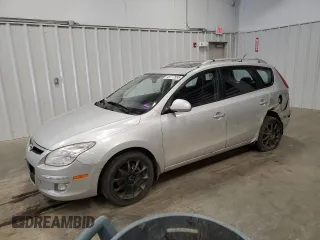 2012 Hyundai Elantra Touring SE with VIN KMHDC8AE6CU135445, listed as a Copart auction lot 49777555 with 215,665 mi miles and Salvage Title. Bid and sale history available at carsss.com. Image 1.