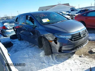 2023 Honda Odyssey Touring with VIN 5FNRL6H80PB005769, listed as a IAAI auction lot 41280858 with 7,041 mi miles and . Bid and sale history available at DreamBid. Image 1.