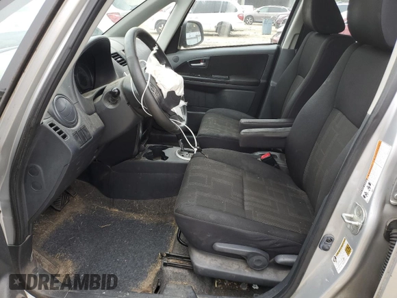 2012 Suzuki SX4 LE with VIN JS2YC5A39C6305357, listed as a Copart auction lot 84146324 with 163,097 mi miles and Salvage Title. Bid and sale history available at carsss.com. Image 7.