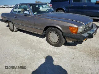 1987 Mercedes-Benz 560 with VIN WDBBA48D7HA063380, listed as a Copart auction lot 77820004 with 81,187 mi miles and Salvage Title. Bid and sale history available at carsss.com. Image 4.