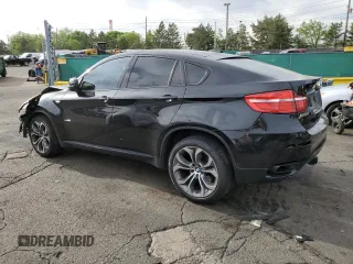 2013 BMW X6 xDrive50i z VIN 5UXFG8C57DL591149, wystawiony jako Copart lot #56979865 z przebiegiem 94 251 mil mil oraz Szkoda całkowita • Salvage title. Historia ofert i sprzedaży dostępna na DreamBid. Obrazek 2.