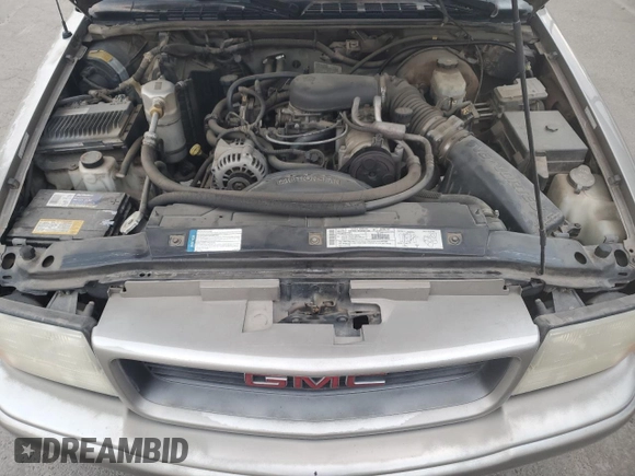 2000 GMC Sonoma SLS z VIN 1GTCS19W9Y8163781, wystawiony jako Copart lot #81001704 z przebiegiem 132 301 mil mil oraz Szkody całkowita. Historia ofert i sprzedaży dostępna na DreamBid. Obrazek 11.