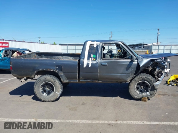 1990 Toyota Pickup SR5 z VIN JT4VN13G7L5019822, wystawiony jako IAAI lot #42194555 z przebiegiem 255 628 mil mil oraz . Historia ofert i sprzedaży dostępna na DreamBid. Obrazek 14.