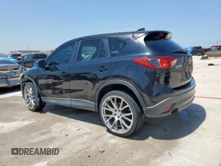 2014 Mazda CX-5 Touring with VIN JM3KE2CY5E0316077, listed as a Copart auction lot 58218735 with 190,789 mi miles and Salvage title. Bid and sale history available at DreamBid. Image 2.
