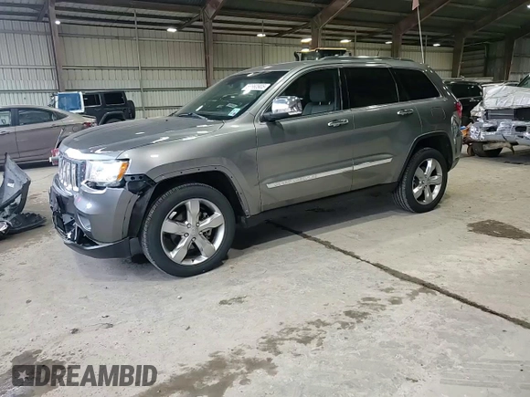 2013 Jeep Grand Cherokee Overland with VIN 1C4RJECT6DC526032, listed as a Copart auction lot 55660905 with 97,406 mi miles and Salvage Title. Bid and sale history available at DreamBid. Image 14.