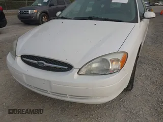 2003 Ford Taurus SE z VIN 1FAFP58S63A158422, wystawiony jako IAAI lot #41933813 z przebiegiem 71 990 mil mil oraz . Historia ofert i sprzedaży dostępna na DreamBid. Obrazek 6.