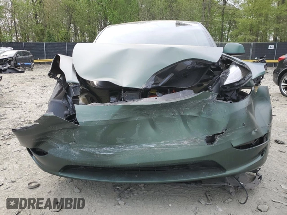 2024 Tesla Model Y Long Range z VIN 7SAYGAEEXRF987104, wystawiony jako Copart lot #54056015 z przebiegiem 24 027 mil mil oraz Szkoda całkowita • Salvage title. Historia ofert i sprzedaży dostępna na DreamBid. Obrazek 5.