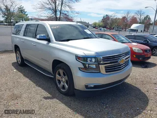 2020 Chevrolet Suburban Premier with VIN 1GNSCJKCXLR219679, listed as a IAAI auction lot 41806579 with 90,132 mi miles. Bid and sale history available at carsss.com. Image 1.