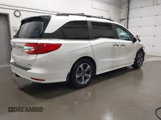 2019 Honda Odyssey Touring with VIN 5FNRL6H8XKB079113, listed as a IAAI auction lot 42359455 with 74,545 mi miles and . Bid and sale history available at DreamBid. Image 4.