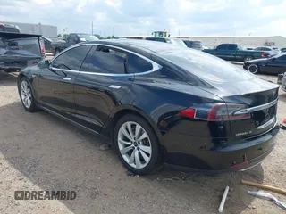 2014 Tesla Model S 60 z VIN 5YJSA1H1XEFP44397, wystawiony jako IAAI lot #42140917 z przebiegiem 136 515 mil mil oraz . Historia ofert i sprzedaży dostępna na DreamBid. Obrazek 3.