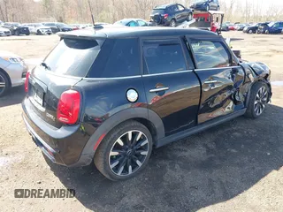 2017 MINI Hardtop 4 Door Cooper S z VIN WMWXU3C39H2F48699, wystawiony jako IAAI lot #41924423 z przebiegiem 81 249 mil mil oraz . Historia ofert i sprzedaży dostępna na DreamBid. Obrazek 4.