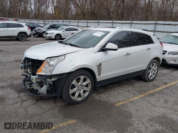 2014 Cadillac SRX Premium Collection z VIN 3GYFNDE34ES548826, wystawiony jako IAAI lot #40792942 z przebiegiem 115 984 mil mil oraz . Historia ofert i sprzedaży dostępna na DreamBid. Obrazek 2.