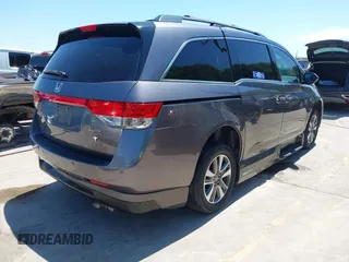 2015 Honda Odyssey Touring Elite z VIN 5FNRL5H99FB017517, wystawiony jako IAAI lot #42246066 z przebiegiem 104 878 mil mil oraz . Historia ofert i sprzedaży dostępna na DreamBid. Obrazek 4.