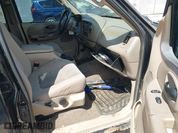 2003 Ford F-150 XLT with VIN 1FTRW07613KC71609, listed as a IAAI auction lot 42186741 with 190,591 mi miles. Bid and sale history available at carsss.com. Image 5.
