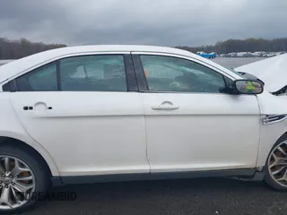 2014 Ford Taurus Limited with VIN 1FAHP2F80EG183153, listed as a IAAI auction lot 40860378 with 163,294 mi miles. Bid and sale history available at carsss.com. Image 14.