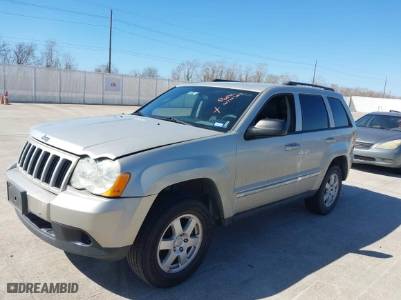 2010 Jeep Grand Cherokee Laredo with VIN 1J4PS4GK1AC111965, listed as a IAAI auction lot 41776362 with 209,042 mi miles. Bid and sale history available at carsss.com. Image 2.