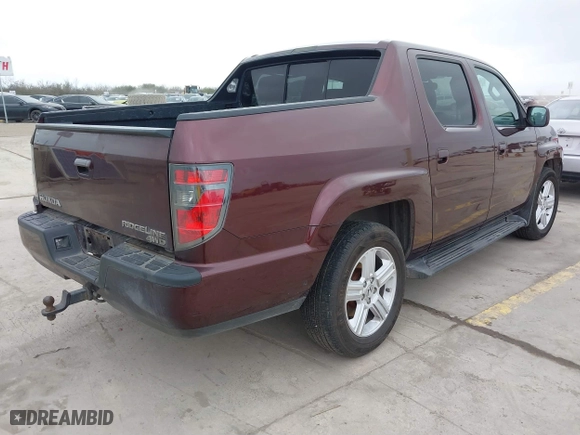 2014 Honda Ridgeline RTL with VIN 5FPYK1F52EB010700, listed as a IAAI auction lot 41490401 with 180,947 mi miles. Bid and sale history available at carsss.com. Image 4.