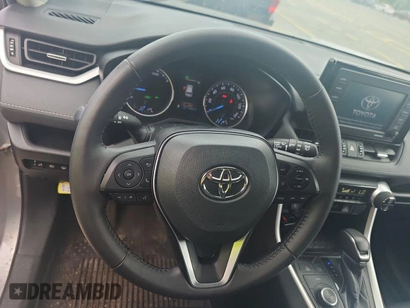 2022 Toyota RAV4 Hybrid XLE Premium with VIN 4T3B6RFV2NU084419, listed as a IAAI auction lot 42729518 with 76,607 mi miles and . Bid and sale history available at DreamBid. Image 14.
