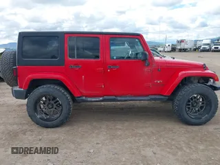 2018 Jeep Wrangler JK Unlimited Sahara with VIN 1C4HJWEG3JL893970, listed as a IAAI auction lot 39530074 with 72,079 mi miles. Bid and sale history available at carsss.com. Image 13.