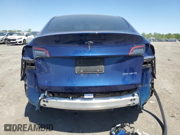 2022 Tesla Model Y Long Range z VIN 7SAYGDEEXNF444122, wystawiony jako Copart lot #54344735 z przebiegiem 33 230 mil mil oraz Szkody całkowita. Historia ofert i sprzedaży dostępna na DreamBid. Obrazek 6.