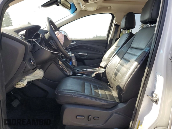 2016 Ford Escape Titanium with VIN 1FMCU9JX5GUC44579, listed as a Copart auction lot 54974965 with 113,776 mi miles and Salvage Title. Bid and sale history available at DreamBid. Image 7.
