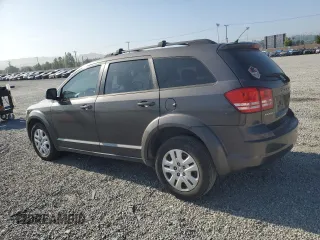 2014 Dodge Journey American Value with VIN 3C4PDCABXET277897, listed as a Copart auction lot 60566735 with 113,343 mi miles and Salvage title. Bid and sale history available at DreamBid. Image 2.