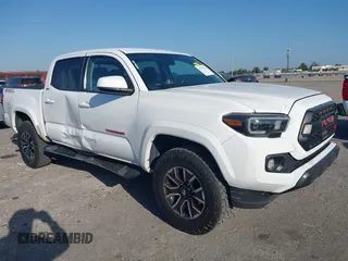 2018 Toyota Tacoma SR with VIN 5TFAX5GN2JX128621, listed as a IAAI auction lot 41797514 with 216,251 mi miles and . Bid and sale history available at DreamBid. Image 1.