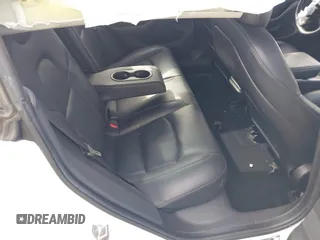 2019 Tesla Model 3 Mid Range with VIN 5YJ3E1EA6KF396946, listed as a IAAI auction lot 41123058 with 69,013 mi miles and . Bid and sale history available at carsss.com. Image 8.
