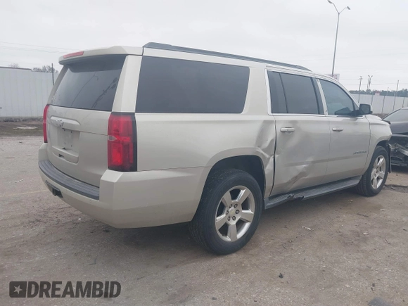 2015 Chevrolet Suburban LT with VIN 1GNSCJKC4FR744208, listed as a IAAI auction lot 41612915 with 87,445 mi miles and . Bid and sale history available at DreamBid. Image 4.