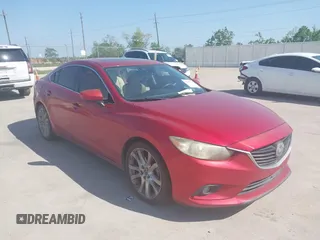 2014 Mazda 6 i Grand Touring with VIN JM1GJ1W65E1141953, listed as a IAAI auction lot 42027145 with 187,514 mi miles and . Bid and sale history available at DreamBid. Image 1.