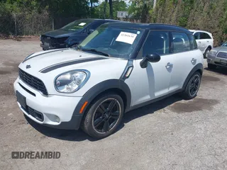 2012 MINI Countryman S z VIN WMWZC3C58CWM26699, wystawiony jako IAAI lot #42361630 z przebiegiem 88 177 mil mil oraz . Historia ofert i sprzedaży dostępna na DreamBid. Obrazek 2.