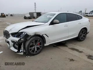 2021 BMW X6 M50i with VIN 5UXCY8C04M9D98395, listed as a Copart auction lot 85536134 with 57,891 mi miles and Salvage Title. Bid and sale history available at carsss.com. Image 1.