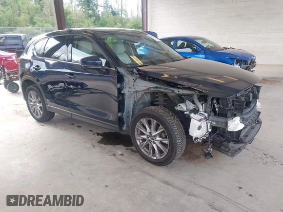 2019 Mazda CX-5 Grand Touring with VIN JM3KFBDM6K0522903, listed as a IAAI auction lot 42583005 with 61,174 mi miles and . Bid and sale history available at DreamBid. Image 1.