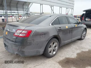 2015 Ford Taurus SEL z VIN 1FAHP2E85FG209085, wystawiony jako IAAI lot #41944532 z przebiegiem 143 850 mil mil oraz . Historia ofert i sprzedaży dostępna na DreamBid. Obrazek 4.