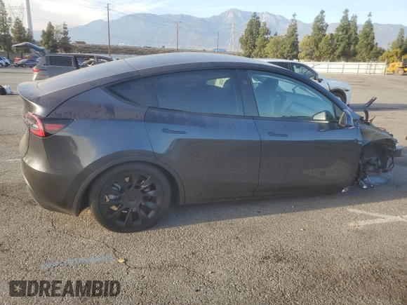 2024 Tesla Model Y with VIN 7SAYGDED7RF056973, listed as a Copart auction lot 87139214 with 15,391 mi miles and Salvage Title. Bid and sale history available at DreamBid. Image 3.