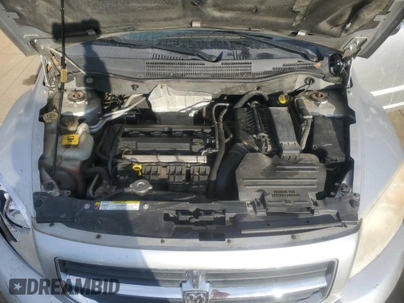 2009 Dodge Caliber SXT z VIN 1B3HB48A59D104136, wystawiony jako Copart lot #45971285 z przebiegiem 291 374 mil mil oraz Szkoda całkowita • Salvage title. Historia ofert i sprzedaży dostępna na DreamBid. Obrazek 11.