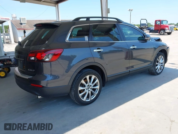 2014 Mazda CX-9 Grand Touring z VIN JM3TB2DA0E0434181, wystawiony jako IAAI lot #42295436 z przebiegiem 78 372 mil mil oraz . Historia ofert i sprzedaży dostępna na DreamBid. Obrazek 4.