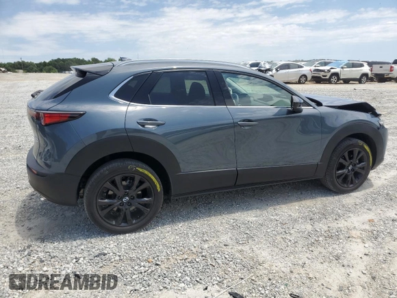 2023 Mazda CX-30 Premium with VIN 3MVDMBDY1PM509621, listed as a Copart auction lot 58316715 with 27,979 mi miles and Salvage title. Bid and sale history available at DreamBid. Image 3.