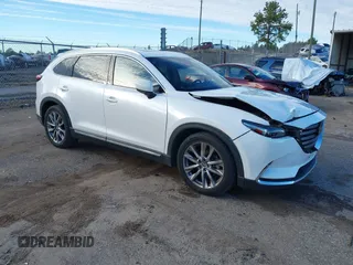 2016 Mazda CX-9 Grand Touring z VIN JM3TCADY4G0124588, wystawiony jako IAAI lot #41192549 z przebiegiem 161 272 mil mil oraz . Historia ofert i sprzedaży dostępna na DreamBid. Obrazek 1.