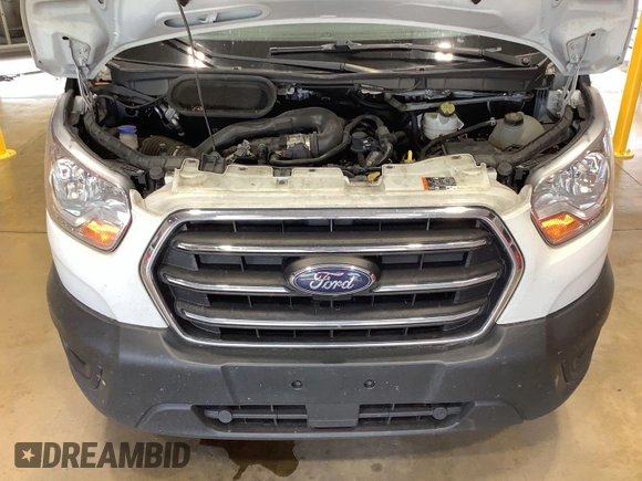 2020 Ford Transit Cargo z VIN 1FTBR1Y8XLKB06141, wystawiony jako IAAI lot #42642640 z przebiegiem 123 417 mil mil oraz . Historia ofert i sprzedaży dostępna na DreamBid. Obrazek 2.