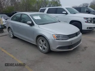 2012 Volkswagen Jetta TDI w/Premium & Nav z VIN 3VWLL7AJ0CM404919, wystawiony jako IAAI lot #41876280 z przebiegiem 147 542 mil mil oraz . Historia ofert i sprzedaży dostępna na DreamBid. Obrazek 1.