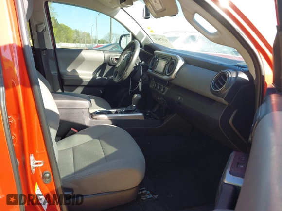 2018 Toyota Tacoma SR5 with VIN 5TFAZ5CN2JX069067, listed as a IAAI auction lot 41975459 with 92,434 mi miles and . Bid and sale history available at DreamBid. Image 5.