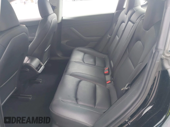 2023 Tesla Model 3 with VIN 5YJ3E1EA5PF647737, listed as a IAAI auction lot 42430145 with 20,525 mi miles and . Bid and sale history available at DreamBid. Image 8.